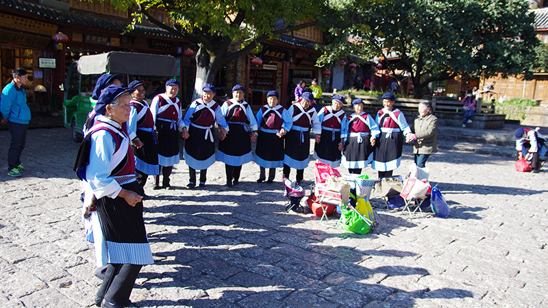Naxi people are dancing in Lijiang Ancient Town