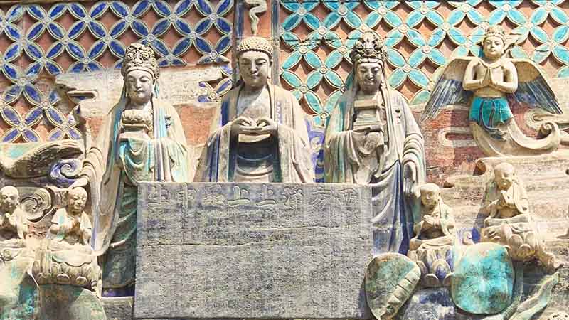 Buddha triad and arhat figures