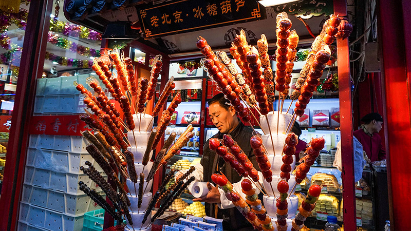 Try Tanghulu, a local snack in Beijing